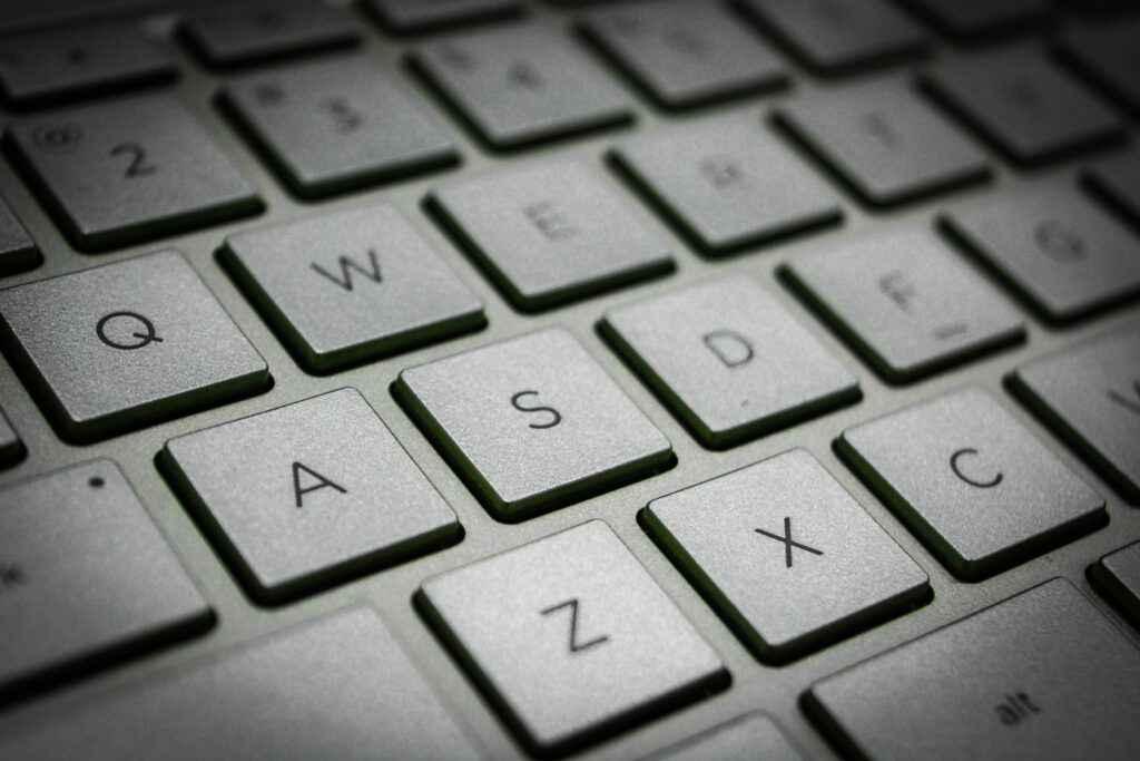 pexels-photo-1114703-1114703 A detailed macro shot of a sleek modern computer keyboard featuring the QWERTY layout.